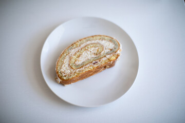 Vanilla White Cake Roll with Cream on a plate