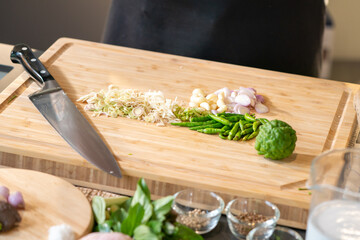  Thai spicies ,lemon grass, garlic, shallot, bergamot and paprika, were prepared to cook by chopped on cutting board.