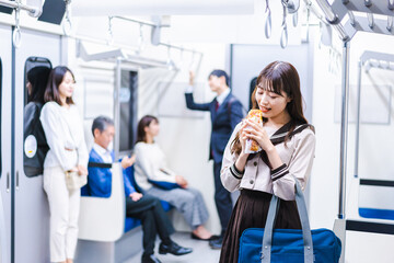 Students eating bread on the train