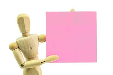 Wooden human dummy manikin with moveable limbs pose holding paper on a white background - 503850175