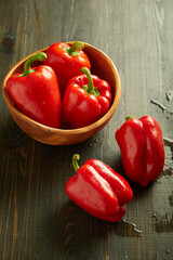 red peppers on a wooden board
