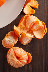 fresh tangerines on wooden table