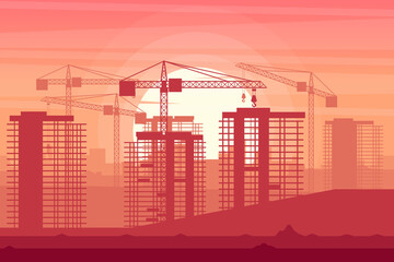 Obraz premium Background landscape of a city under construction with cranes in a sunset