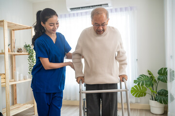 Asian senior elderly man patient doing physical therapy with caregiver