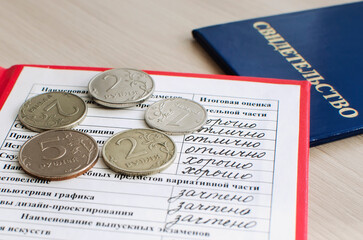 Russian certificate with good grades in all subjects with a financial bonus for good services. The concept of the economic crisis in Russia.