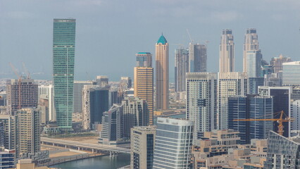 Fototapeta na wymiar Skyline with modern architecture of Dubai business bay towers timelapse. Aerial view