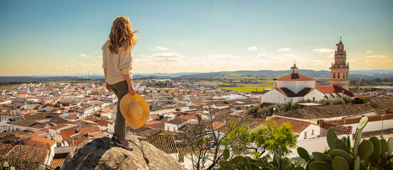 woman tourist, enjoying beautiful view of Burguillos del Cerro, Spanish village