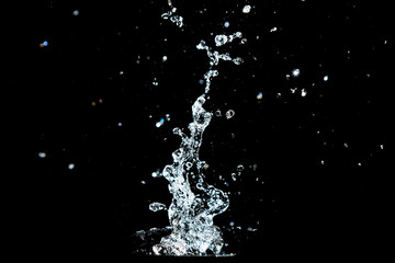 Abstract background of Water splashing on a black background. idea for freshness