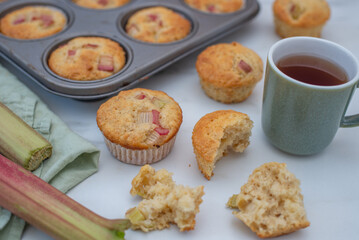 home made almond rhubarb muffins on a table