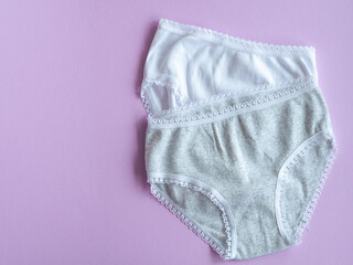 Panties for girls on purple, knitted cotton underwear. Underwear for children