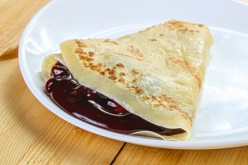 Delicous pancake with fruit jam