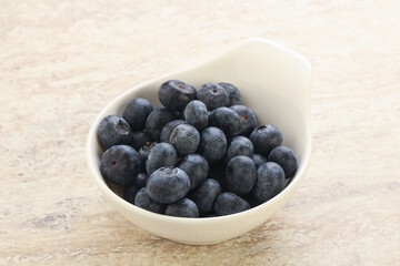 Sweet ripe blueberry heap in the bowl