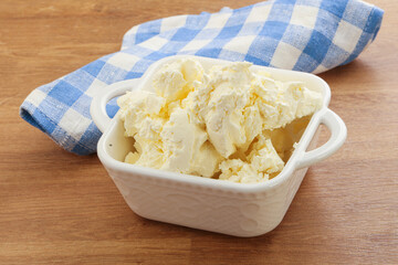 Italian soft mascarpone cheese in the bowl