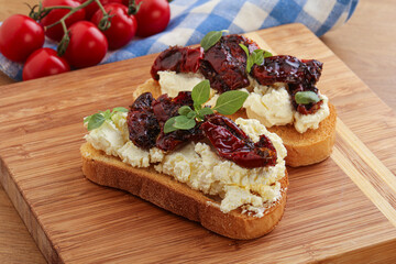 Bruschetta with soft cheese and tomato