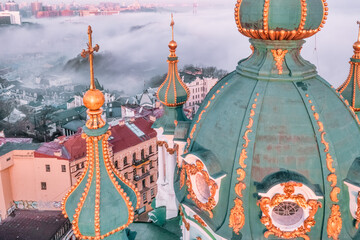 Aerial view of St. Andrew's Church in heavy fog, Kyiv, Ukraine. Concept, travel, tourism