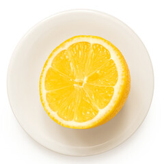 Half of fresh lemon on white plate from above.