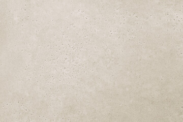 Beige stone texture background. Wide banner with soft concrete grunge pattern on copy space