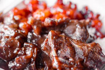 Chinese American food, fried chicken pieces in a common sauce, close-up, macro photography, shallow depth of field. Concept, delicious food