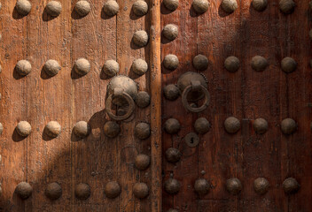 Detail of an old wooden door in Toledo, Spain