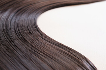 texture of beautiful glossy long hair.Curl female healthy hair. Concept hairdresser spa salon....