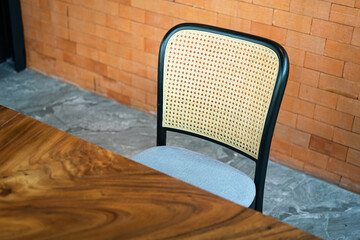 A classic style chair with crafted bamboo backrest part. Interior decoration object photo....
