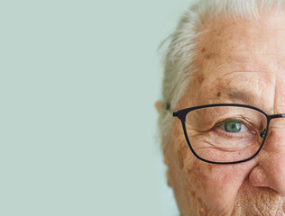 half portrait of an elderly pensioner woman in glasses