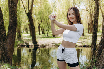 young woman doing exercises in the park