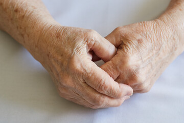 Fototapeta premium Close-up Hands of an old woman with wrinkles