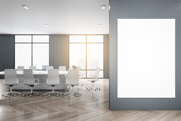 Modern meeting room interior with mock up poster on wall, wooden flooring, furniture, city view and daylight. 3D Rendering.