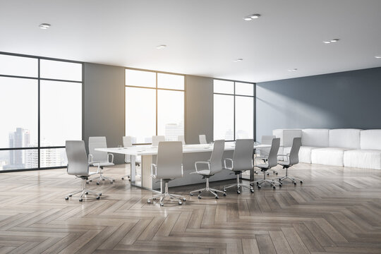 Contemporary meeting room interior with wooden flooring, furniture, city view and daylight. 3D Rendering.