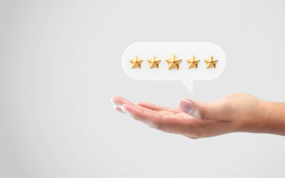 Hand review customer feedback rating gold star service best product quality of positive ranking evaluation rate or user experience good satisfaction and excellent business success on vote background.