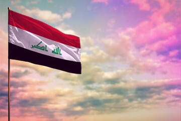 Fluttering Iraq flag mockup with the space for your content on colorful cloudy sky background. - obrazy, fototapety, plakaty