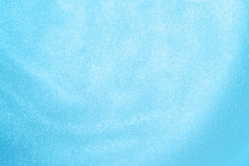 Naklejka premium Blue sparkling background. glitter background.