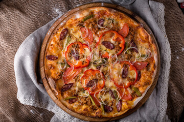 delicious pizza hunting sausages bell peppers onions tomatoes 