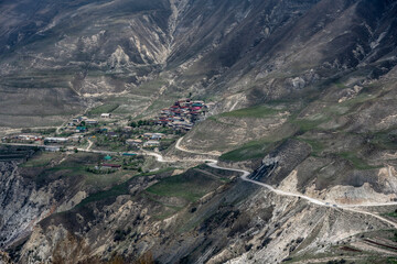 beautiful mountain peaks are buried in clouds and surrounded by winding mountain roads