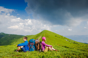 Caucasian active couple enjoying the view on their hiking trip