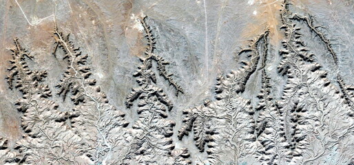 abstract landscape photo of the deserts of Africa from the air emulating the shapes and colors of...