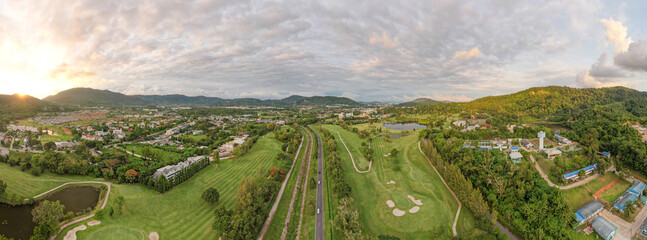 Aerial view panorama green golf field in Kathu district Phuket Thailand. Amazing landscape Drone...