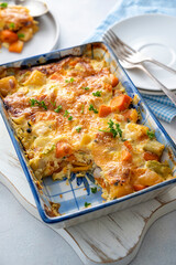 Vegetable gratin with sweet potato, celery, parsnip, carrot, cheese and eggs. Comfort, rustic one casserole food.