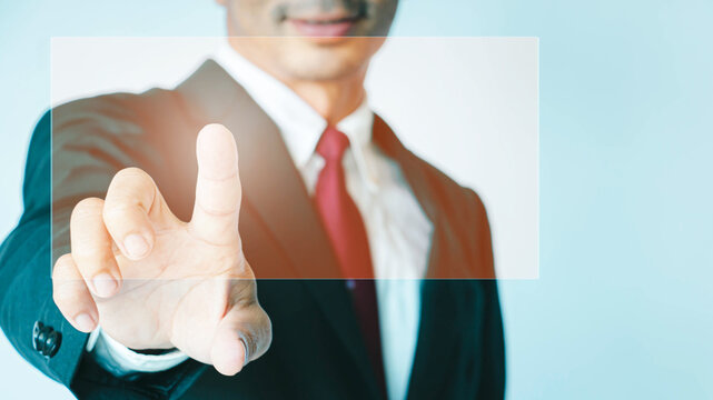 Businessman touching an imaginary with contact on virtual screen business, technology, internet, and networking concept