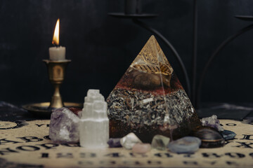Mystic ritual with Ouija and candles. Devil's board concept, black magic or fortune telling rite with occult and esoteric symbols. Mystical rituals and occult sciences.