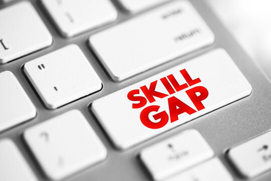 Skills Gap is a gap between the skills an employee has and the skills he or she actually needs to perform a job well, text button on keyboard