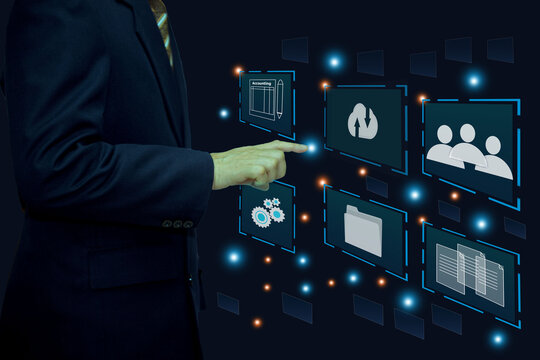 Enterprise resource planning(ERP) and management documentation concept. Businessman working on virtual digital screen icons.