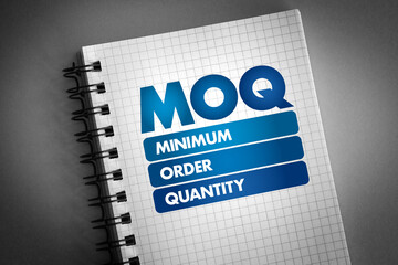 MOQ - Minimum Order Quantity acronym on notepad, business concept background - obrazy, fototapety, plakaty