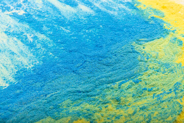 Fototapeta na wymiar Ukrainian flag colours. The concept of war in Ukraine. Blue and yellow background from holi powder paint.