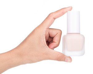 Hand holding Foundation cosmetic bottle isolated on white background.
