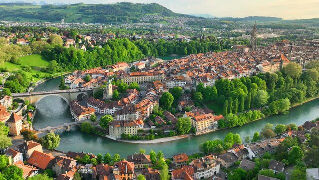 Bern aerial view, capital of Switzerland, tourism in Switzerland concept, drone view of Bern with bridges, historic towers and churches at sunset