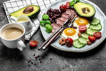Ketogenic diet meal avocado, fried eggs, bacon, and beans. Healthy nutritious paleo keto breakfast diet lunch. banner, catering menu recipe place for text, top view