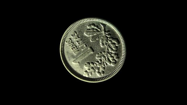 Rotating reverse of Lithuania coin 1 lit 1925 with inscription meaning ONE LIT. Isolated in black background.