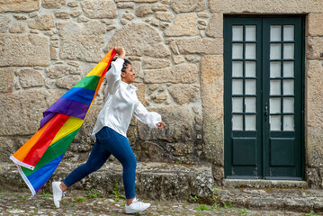 women with lgtb rainbow flag